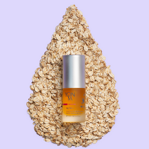 Small bottle of Booster Nutri+ | Yon-Ka Paris placed on a teardrop-shaped bed of oats on a light purple background, highlighting skincare and wellness supplements.