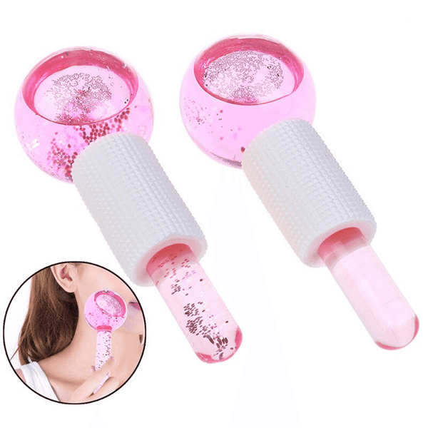 Two pink Glow Globes [Ice Roller for Face] | Dreambox Beauty with textured white handles and glitter inside, shown with a woman using one on her facial skin for skincare and wellness.