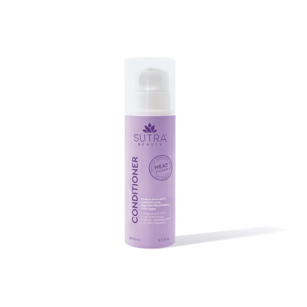 A lavender-colored bottle of Heat Guard Conditioner | SUTRA with a white pump cap, designed to protect hair from heat damage while supporting wellness and care.