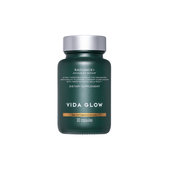 Bottle of Radiance+ Capsules | VIDA GLOW dietary supplement featuring advanced repair formula for skin health enhancement with 30 capsules in a dark green container.