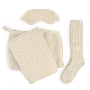 Travel Set (Blanket, Socks, Eyemask, Bag) | Kashwére in soft beige, featuring a plush blanket, cozy socks, a comfortable eyemask, and a matching zippered bag for wellness and relaxation.