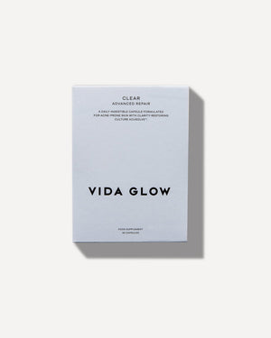 Minimalist white box packaging of Clear Capsules | VIDA GLOW, a skincare supplement designed for acne-prone skin with advanced repair and clarity-restoring benefits.