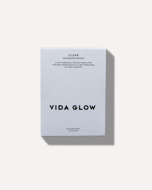Minimalist white box packaging of Clear Capsules | VIDA GLOW, a skincare supplement designed for acne-prone skin with advanced repair and clarity-restoring benefits.
