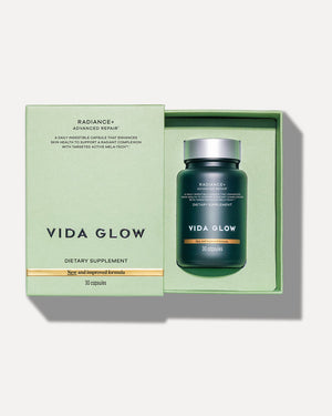 Open green box containing a bottle of Radiance+ Capsules | VIDA GLOW dietary supplement with 30 capsules for skincare and wellness.