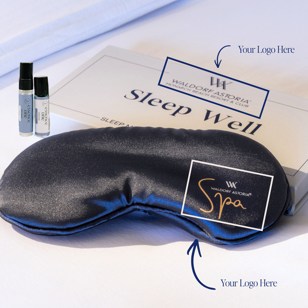 Eye Mask Gift Box- Private Label | Essence One with black satin sleep mask and skincare vials beside a Sleep Well box featuring customizable logo areas for spa branding