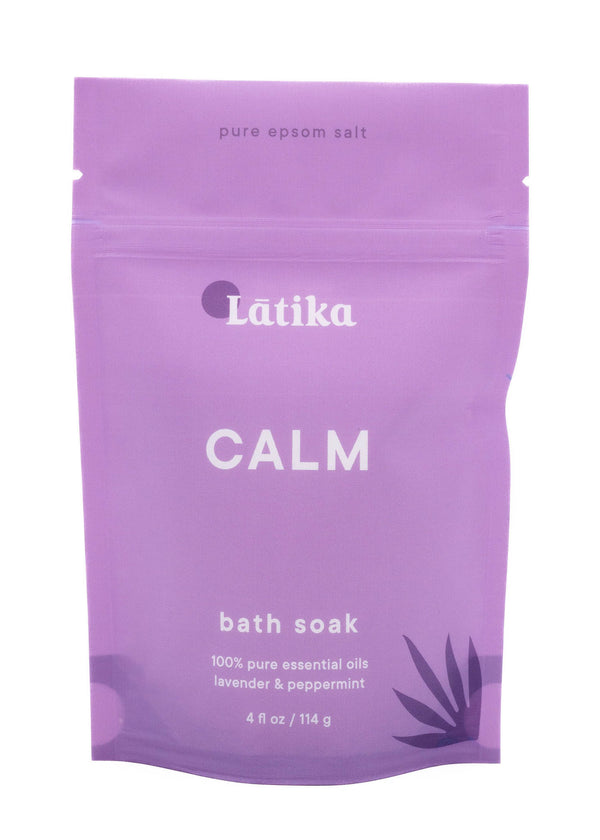 Purple resealable pouch of Bath Soak | Latika Calm featuring pure epsom salt and essential oils of lavender and peppermint for relaxation and skin wellness.