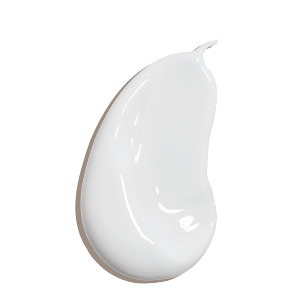 Smooth white cream texture of Classic Body Organic Sunscreen Lotion SPF 50 - Guava Mango | COOLA, illustrating its lightweight and moisturizing body care formula.
