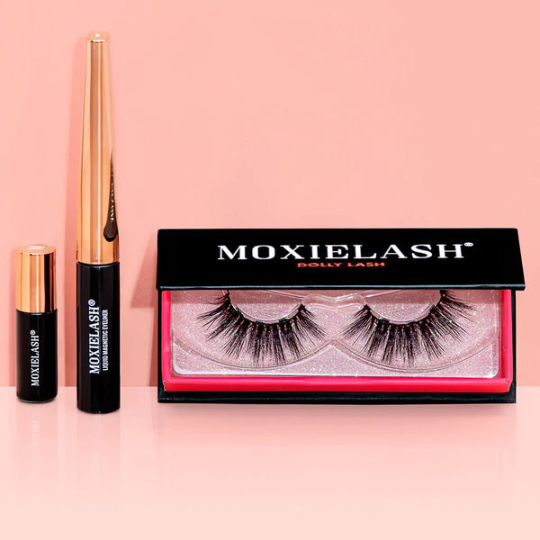 Set of Dolly Lash | Moxielash false eyelashes with black and gold eyeliner and adhesive on a pink background, highlighting beauty and eyelash enhancement products.