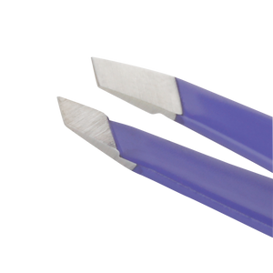 Close-up of stainless steel precision tips on a purple handled Blooming Lilac Mini Slant Tweezer | Tweezerman designed for detailed grooming and skincare use.