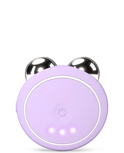 BEAR™ 2 Go | FOREO in lavender with metallic massage spheres, a compact skincare device designed for facial toning and recovery, featuring an LED power button and three indicator lights.