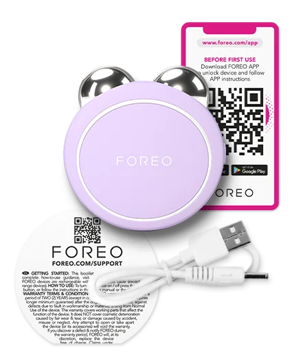 BEAR™ 2 Go | FOREO in lavender with metallic massage spheres, USB charging cable, and a QR code instruction card, designed for skincare and body care wellness.