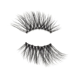 Pair of black, wispy false eyelashes designed for a natural yet voluminous look, labeled Foxy Lash | Moxielash, ideal for enhancing eye makeup with lightweight comfort.