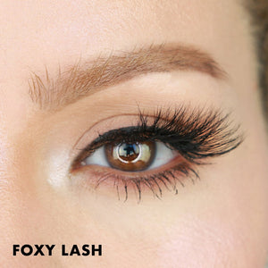 Close-up of a brown eye with long, thick, and voluminous eyelash extensions, showcasing the dramatic effect of Foxy Lash | Moxielash for enhanced eye beauty.