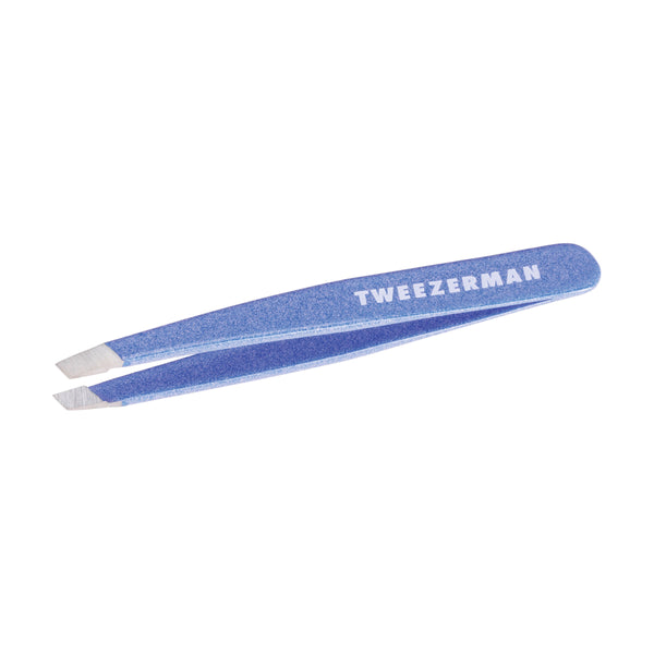 Granite Sky Mini Slant Tweezer | Tweezerman in a textured blue finish designed for precise hair removal with a compact, ergonomic shape for skincare and beauty care.