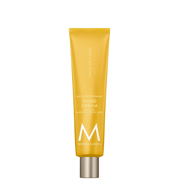 Tube of Hand Cream | Moroccanoil in yellow packaging with silver cap, designed for skincare and body care with nourishing ingredients and hyaluronic acid.