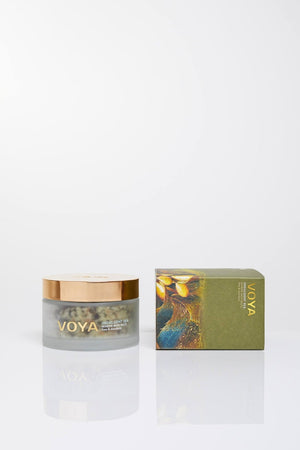 Indulgent Sea Marine Bath Salts | VOYA in a clear jar with gold lid alongside its green artistic packaging, highlighting luxurious skincare and wellness body care.