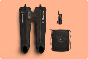 JetBoots Prime | Therabody recovery device with black compression leg sleeves, remote control, charging cable, and branded carrying bag on a peach background.