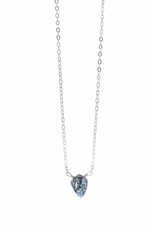 Insightful Teal Kyanite Sterling Silver Necklace | Liv & B featuring a delicate silver chain with a unique teal kyanite pendant showcasing natural stone patterns and polished elegance.