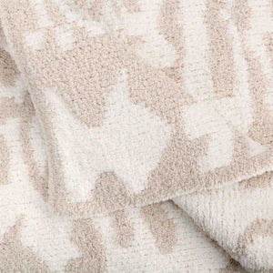 Close-up view of a soft textured fabric featuring a subtle beige and cream damask pattern in Throws - Damask - Chenilla Cloud™ | Kashwére.