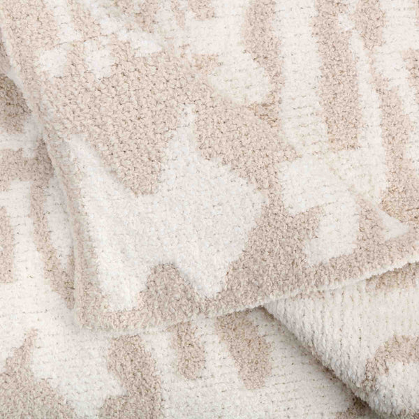 Close-up view of a soft textured fabric featuring a subtle beige and cream damask pattern in Throws - Damask - Chenilla Cloud™ | Kashwére.