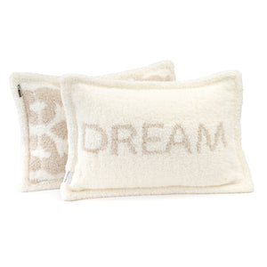 Two soft cream-colored pillows with plush chenilla texture, one featuring the word DREAM and the other a subtle decorative pattern, from Pillows - Dream - Chenilla Cloud™ | Kashwére.