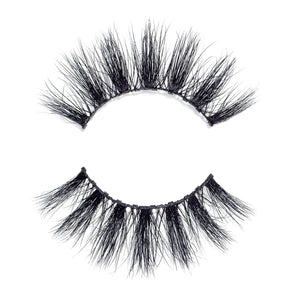 Close-up of dramatic, voluminous false eyelashes in black, designed for enhancing eye appearance with the Money Lash | Moxielash style.