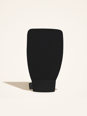 Exfoliating Mitt | NUDA in black with a textured surface designed for effective skincare and body care exfoliation.
