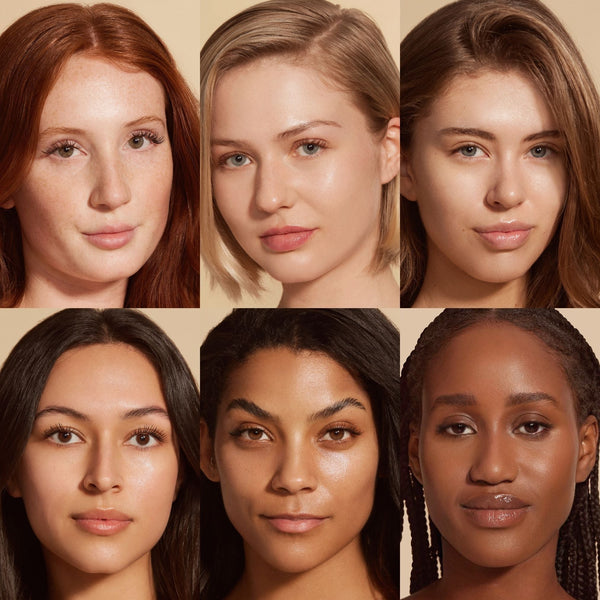 Diverse group of women with clear, glowing skin showcasing natural beauty and healthy complexions, highlighting skincare benefits of Solarglow™ Mineral Serum Sunscreen | NUDA.