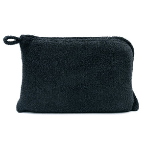 Soft black textured pouch made from plush material, designed to store and carry items from the Travel Set (Blanket, Socks, Eyemask, Bag) | Kashwére.