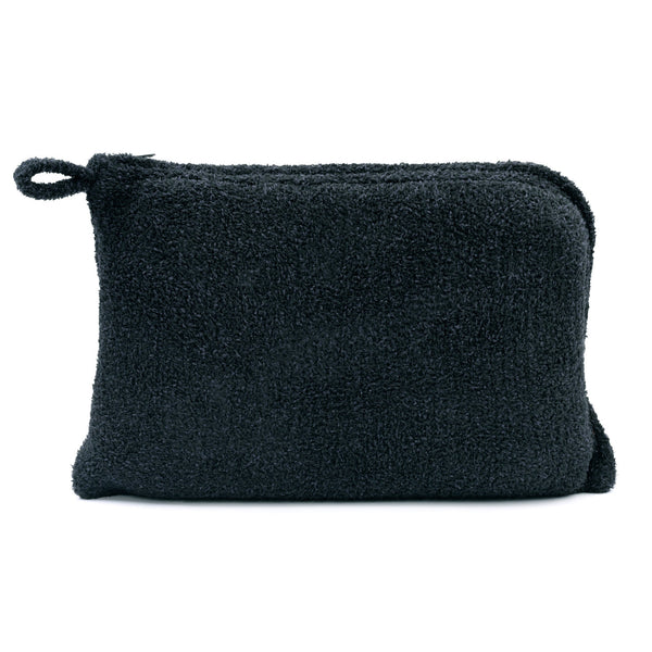 Soft black textured pouch made from plush material, designed to store and carry items from the Travel Set (Blanket, Socks, Eyemask, Bag) | Kashwére.