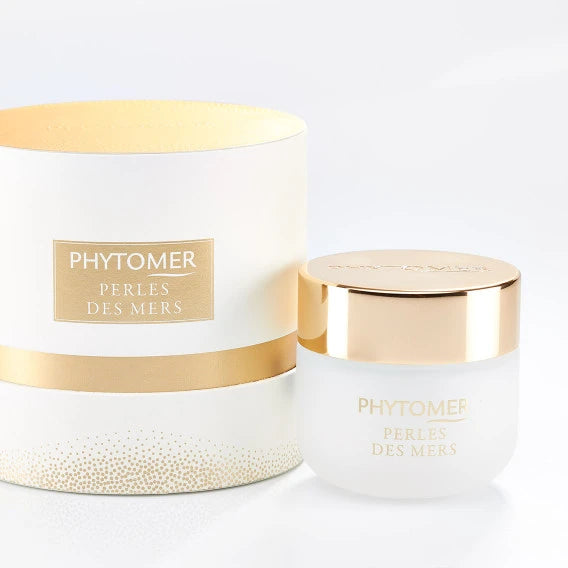 Jar of Perles Des Mers Longevity Cream | Phytomer with a white body and shiny gold lid, showcasing skincare and body care luxury product packaging.