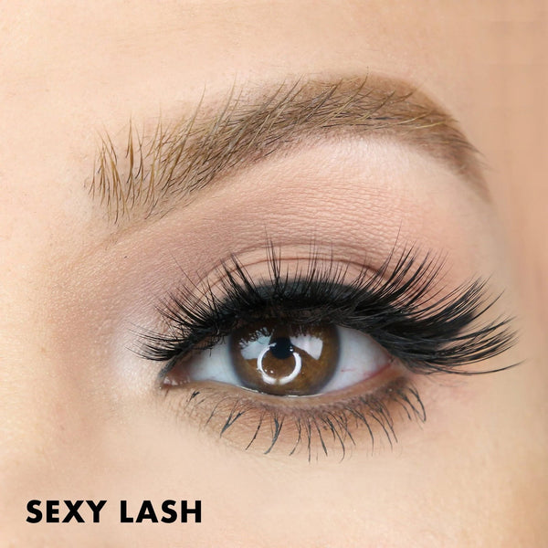 Close-up of a brown eye with long, voluminous lashes enhanced by Sexy Lash | Moxielash eyelash extensions for a glamorous, bold look.