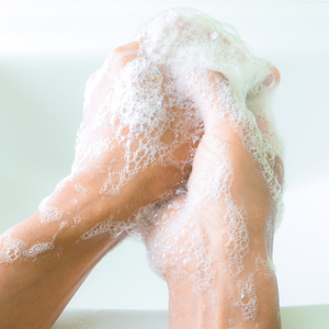Hands covered in rich foam lather while using Cleansing Body Wash | Privai, emphasizing gentle skincare and effective body cleansing.