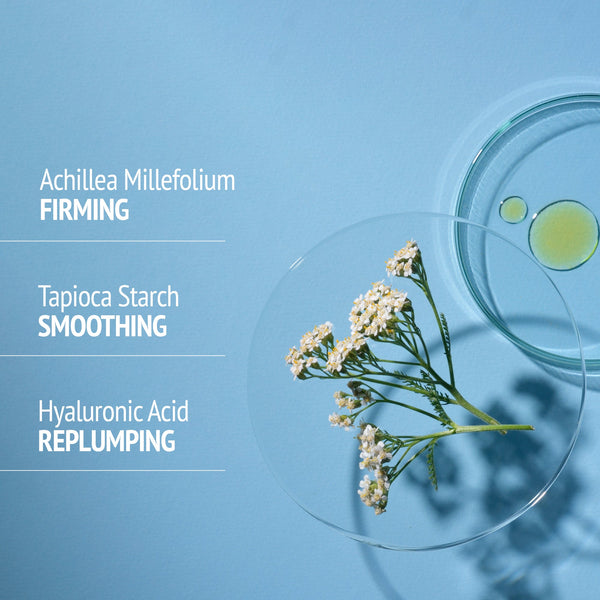 Sublime Skin Lift & Firm Ampoules | [ comfort zone ] ingredient highlights with Achillea Millefolium for firming, Tapioca Starch for smoothing, and Hyaluronic Acid for replumping, displayed on a blue background with flower and liquid drops in clear dishes.