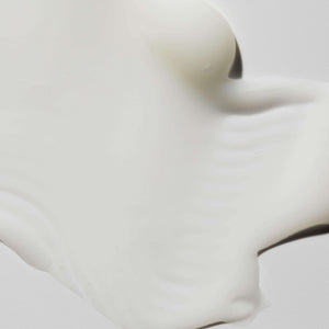 Creamy smooth texture of Body Serum | Omorovicza displayed on a light surface, highlighting its rich and luxurious skincare formula for body care.