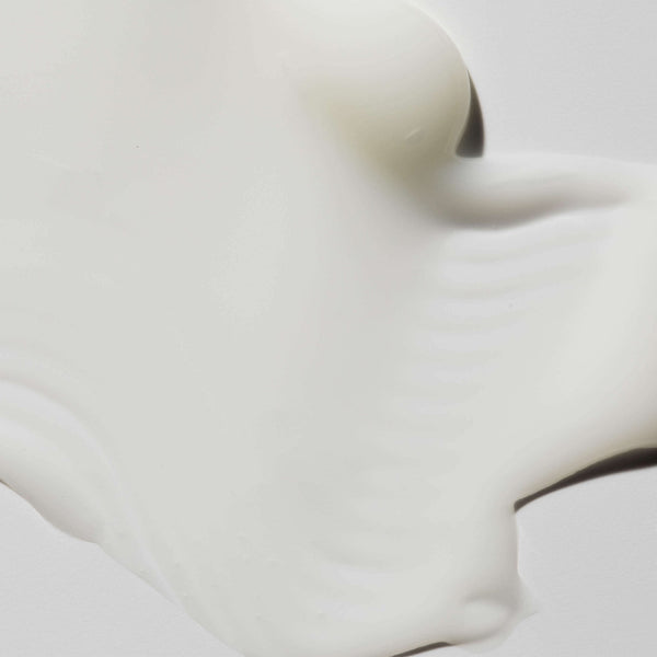 Creamy smooth texture of Body Serum | Omorovicza displayed on a light surface, highlighting its rich and luxurious skincare formula for body care.