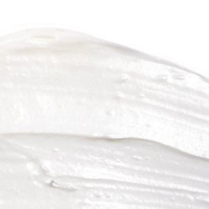 Close-up texture of creamy white skincare product representing Tone-n-Tighten Eye Cream with Instalift | Skin Fitness Therapy, emphasizing smooth and rich consistency.