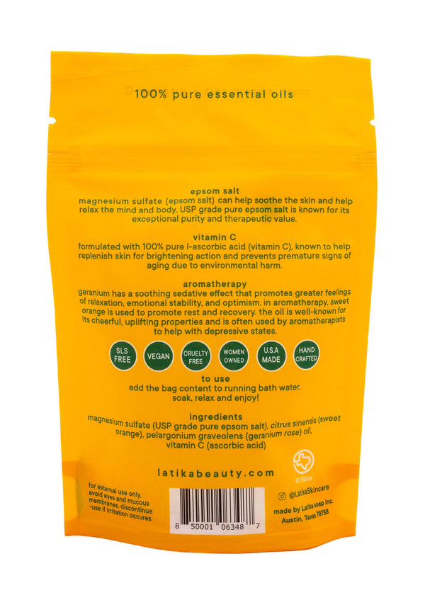 Back of bright yellow packaging for Bath Soak | Latika featuring product benefits, ingredients including magnesium sulfate and vitamin C, and usage instructions for skincare and wellness.