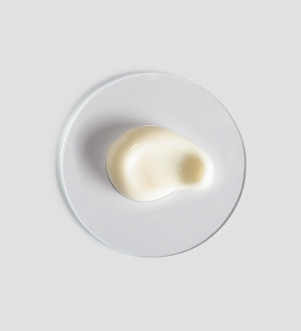 Close-up of a smooth cream sample on a white surface representing the texture of Renight Mask | [ comfort zone ], a skincare product for nighttime wellness and skin recovery.