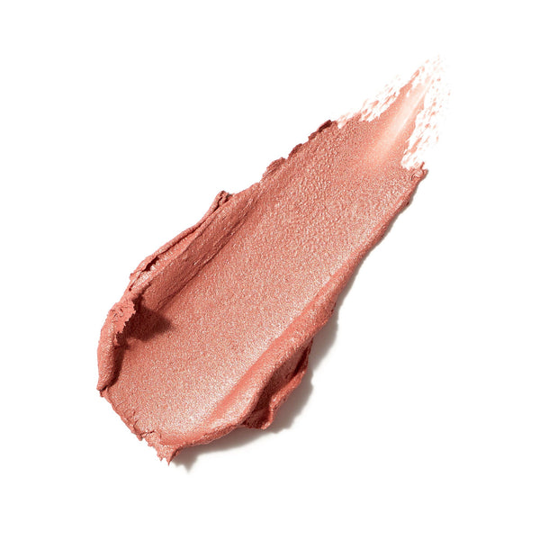 Smudged creamy swatch of soft pink blush with a subtle shimmer representing Glow Time Blush Stick | Jane Iredale for a radiant natural look.