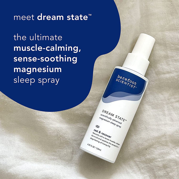 Bottle of DREAM STATE | Barefoot Scientist magnesium sleep spray on a soft fabric background, promoting muscle-calming and sense-soothing benefits for restful recovery.