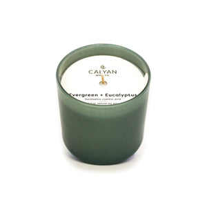 Evergreen + Eucalyptus Dignity Series Glass Jar Soy Candle | Calyan Wax Co. - 5.3 oz in a matte green glass container, offering a fresh, natural scent perfect for wellness and relaxation.