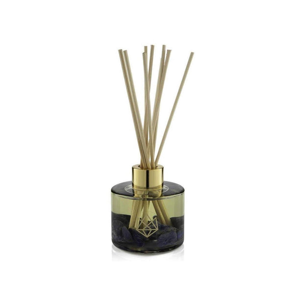 Calm Reed Diffuser | Aluminate Life with natural wooden reeds in a translucent smoky glass container accented with gold detailing, offering a serene and elegant wellness aroma experience.