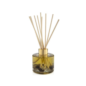 Defense Reed Diffuser | Aluminate Life featuring a glass bottle with aromatic oil and natural reed sticks for a calming and refreshing wellness ambiance.