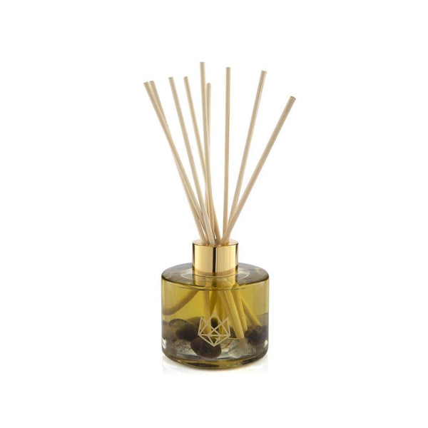 Defense Reed Diffuser | Aluminate Life featuring a glass bottle with aromatic oil and natural reed sticks for a calming and refreshing wellness ambiance.