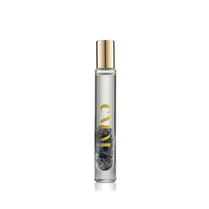 Clear glass roll-on vial with gold cap containing natural stones and liquid, labeled CALM, part of the Defense Essential Oil Vial | Aluminate Life wellness collection.
