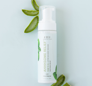 Ahhhsome Relief™ Foam-to-Oil After Sun Body Mousse | Farmhouse Fresh bottle with aloe vera leaves on a light background, highlighting soothing skincare and body care.