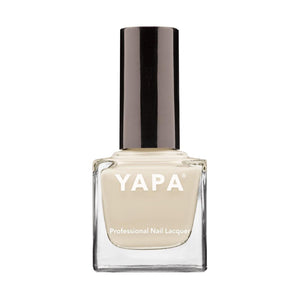 Clear square glass bottle of Amy Nail Lacquer | YAPA with beige nail polish and sleek black cap, designed for professional nail care and wellness.