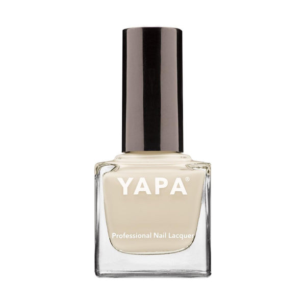 Clear square glass bottle of Amy Nail Lacquer | YAPA with beige nail polish and sleek black cap, designed for professional nail care and wellness.