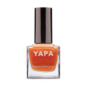 Bottle of Andrew Nail Lacquer | YAPA in a vibrant orange shade with a sleek black cap, designed for professional nail care and polish.